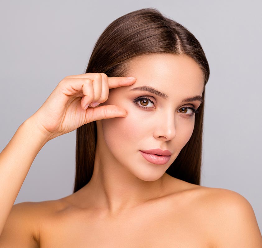 Woman touching her face